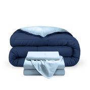 A reversible microfiber comforter and a coordinating sheet set folded and stacked