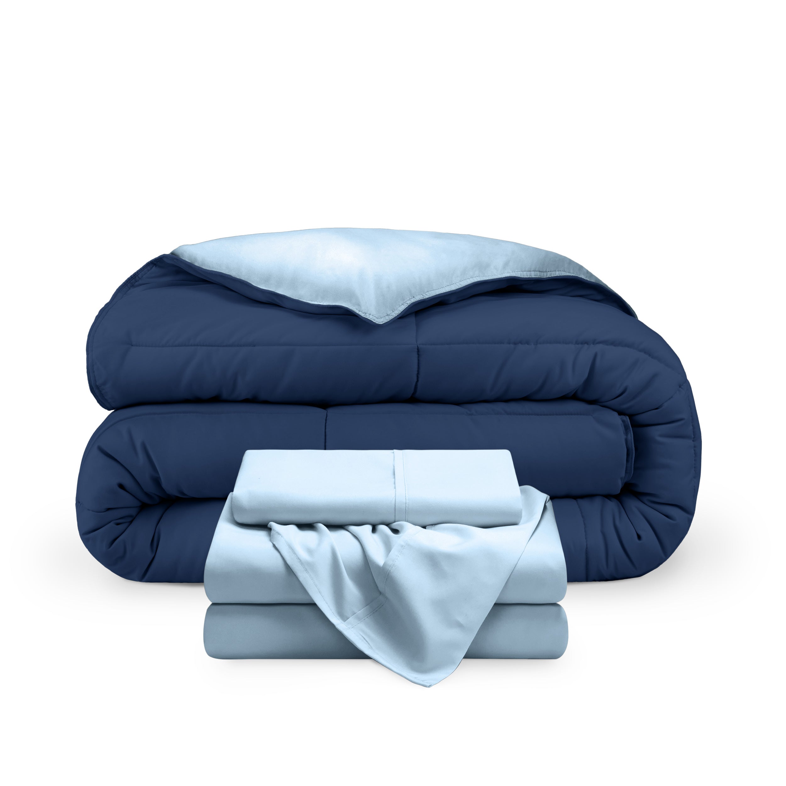 A reversible microfiber comforter and a coordinating sheet set folded and stacked
