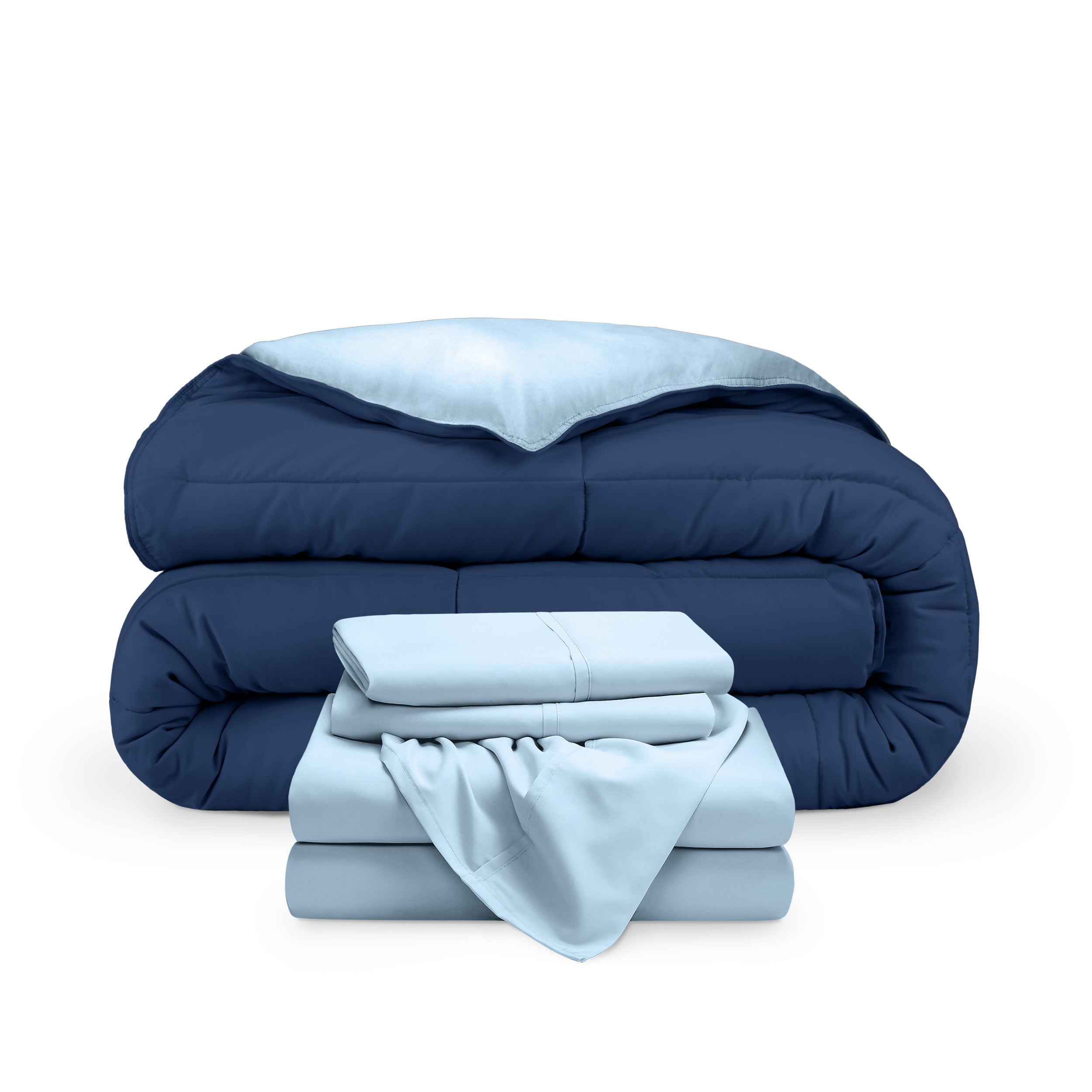 A reversible microfiber comforter and a coordinating sheet set folded and stacked