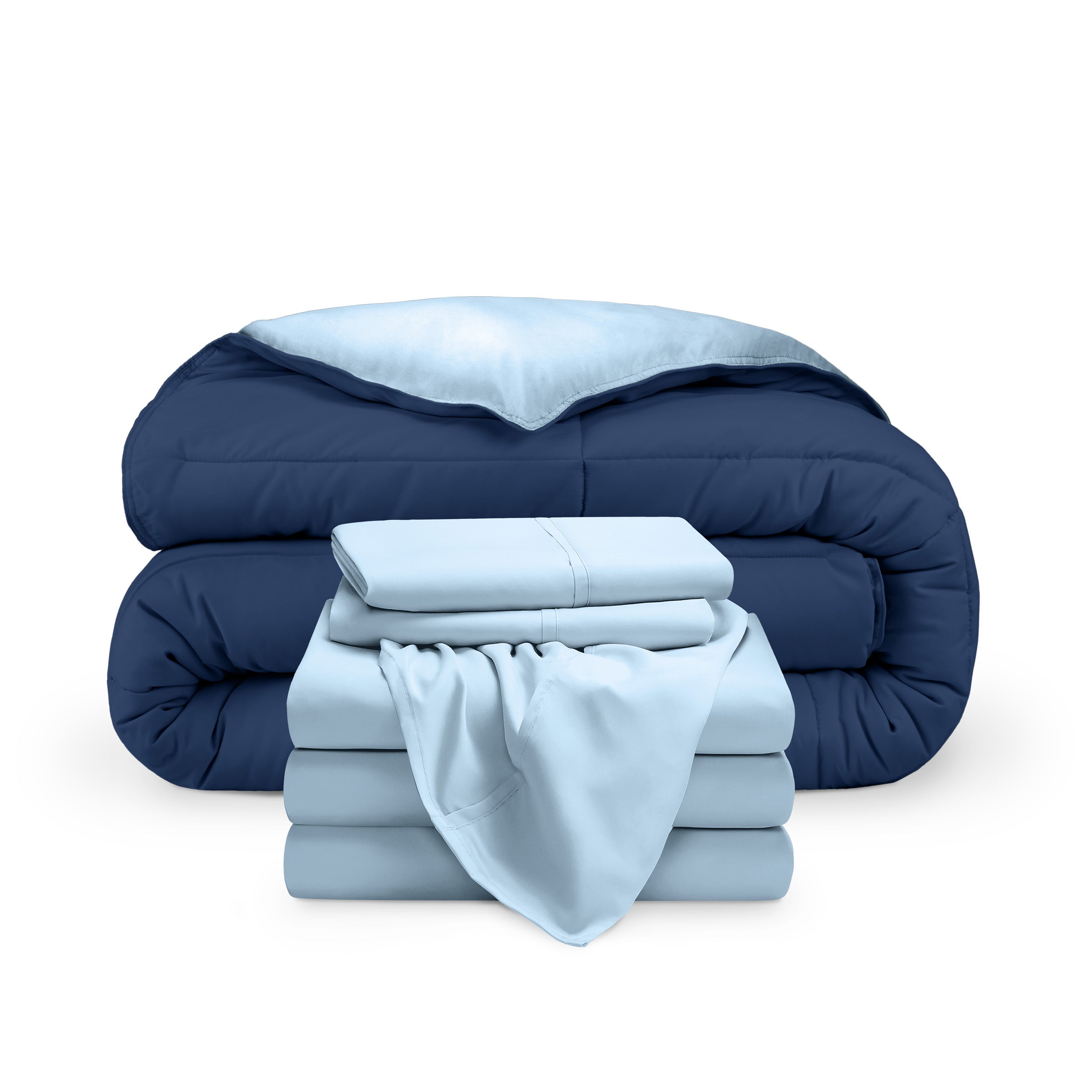 A reversible microfiber comforter and a coordinating sheet set folded and stacked