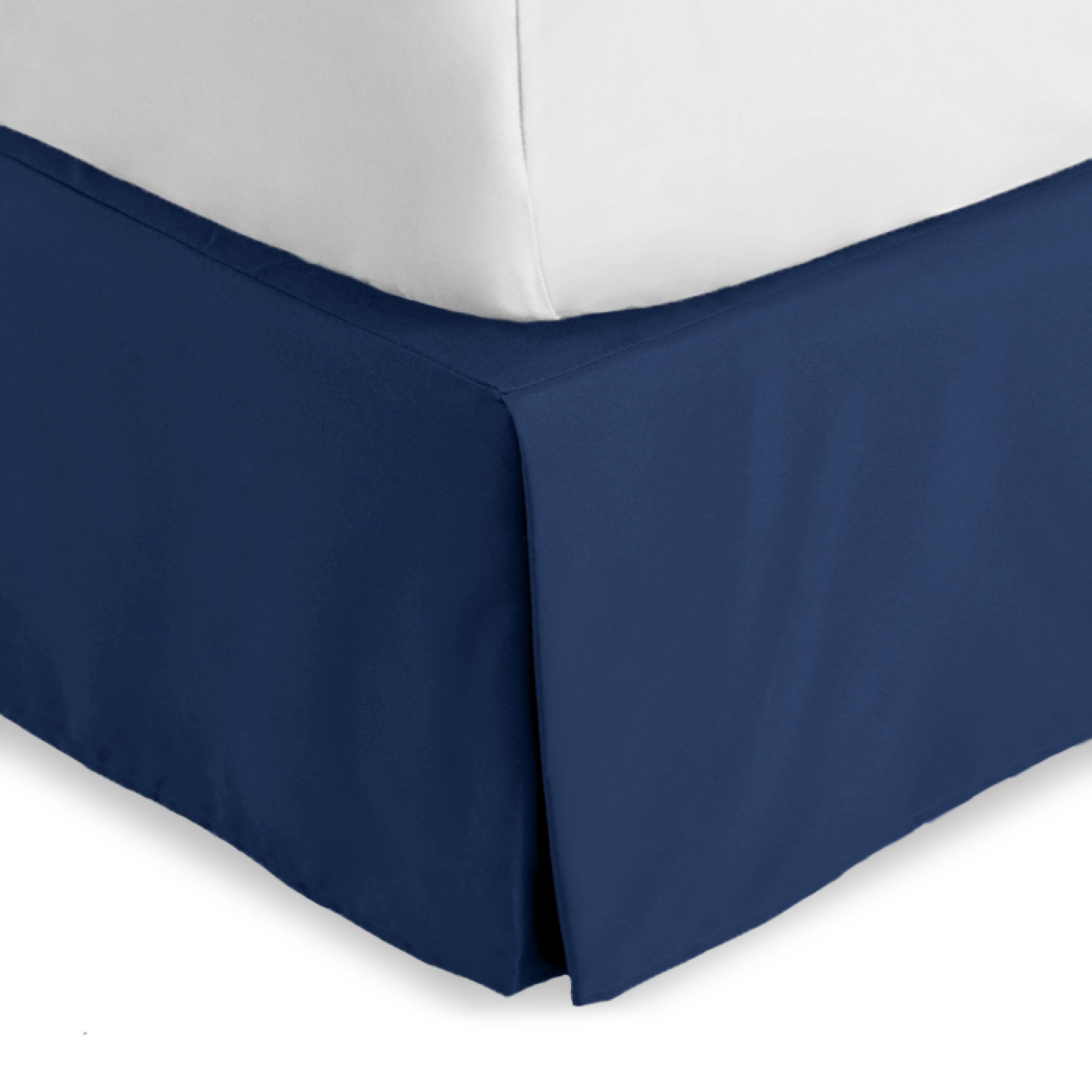 The corner of a bed skirt on a bed frame