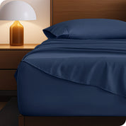 A cozy bedroom with a bed covered in soft microfiber sheets