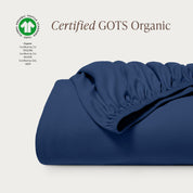 A single certified GOTS organic cotton fitted sheet folded