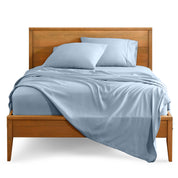 Microfiber sheet set on a bed with a wooden bed frame