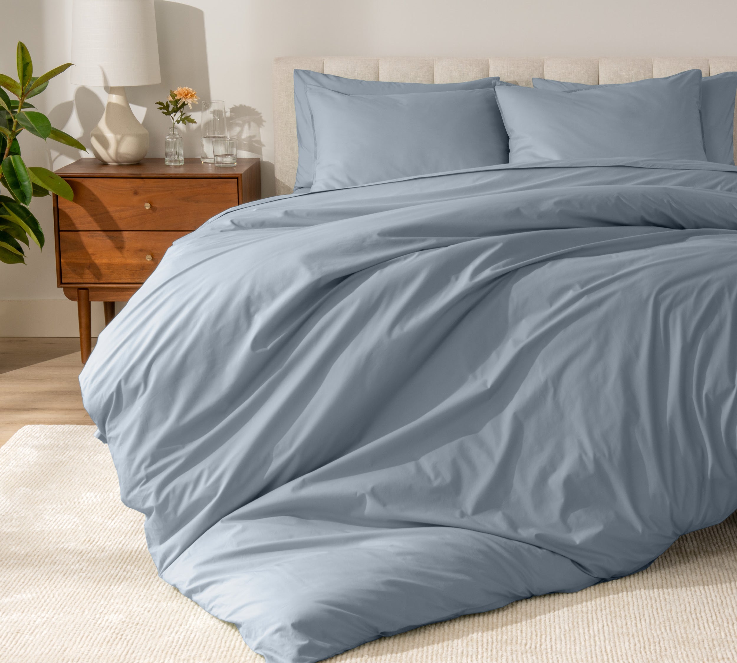 A modern bed with a organic cotton percale duvet cover on.