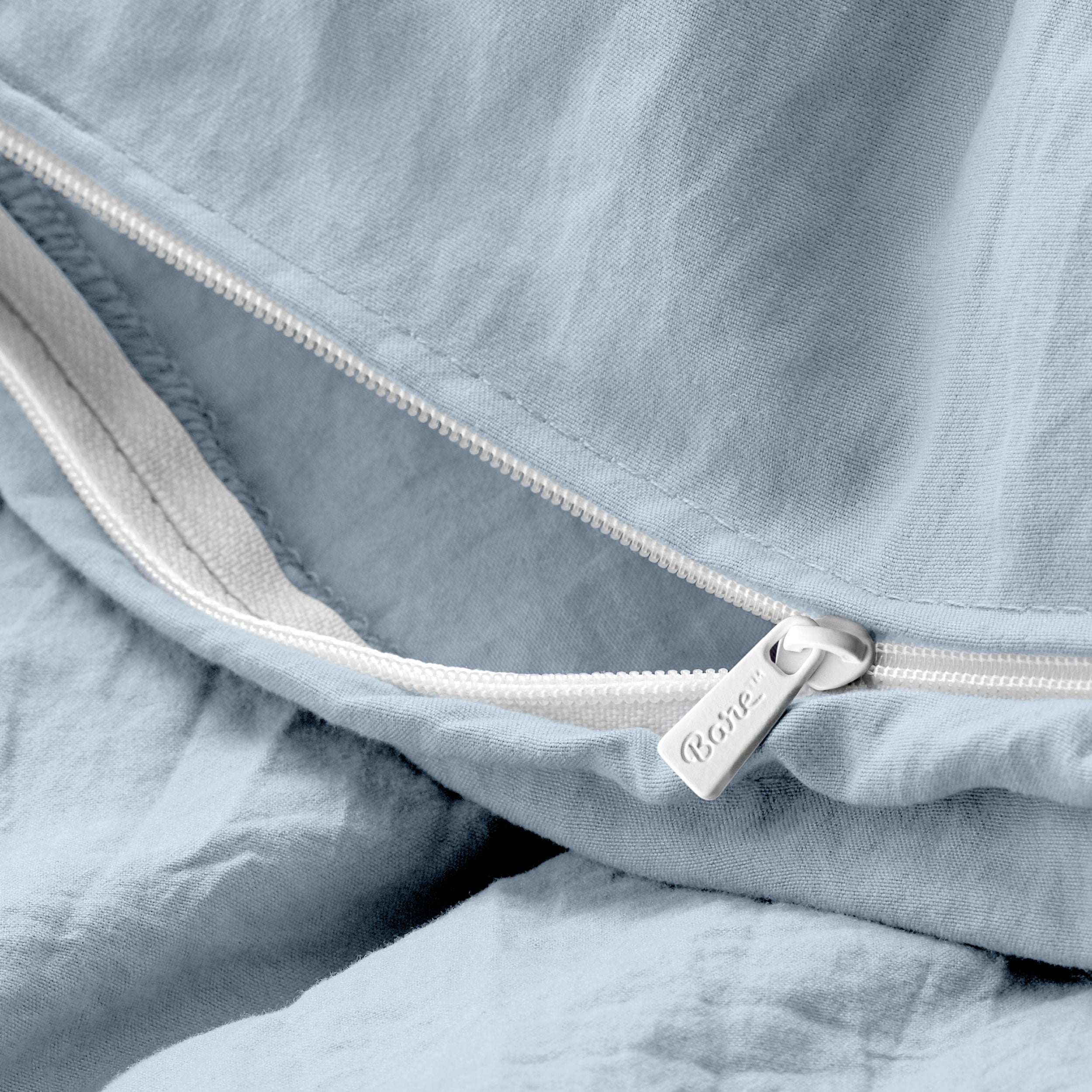 Close up of the zipper on the duvet cover partially opened