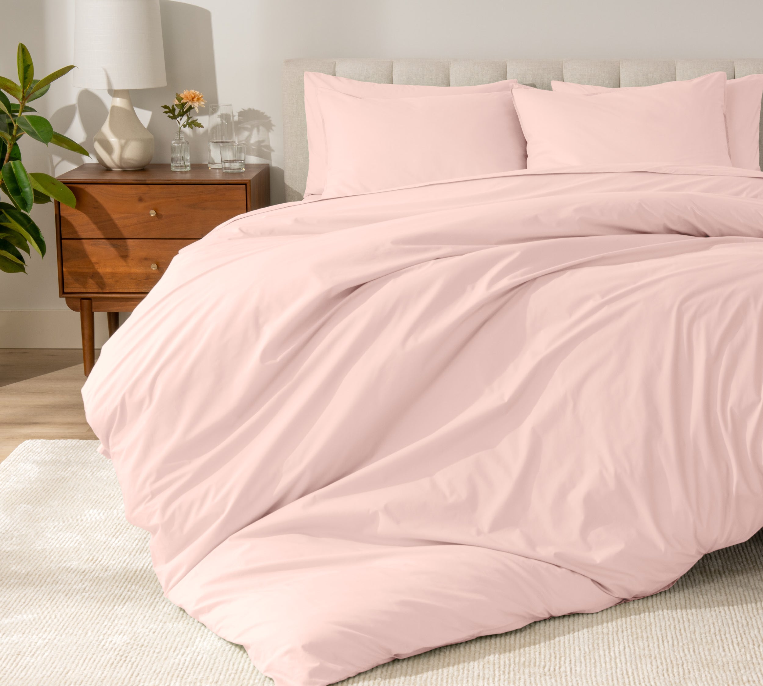 A modern bed with a organic cotton percale duvet cover on.