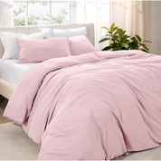 Angled view of bed with a duvet cover folded over on itself