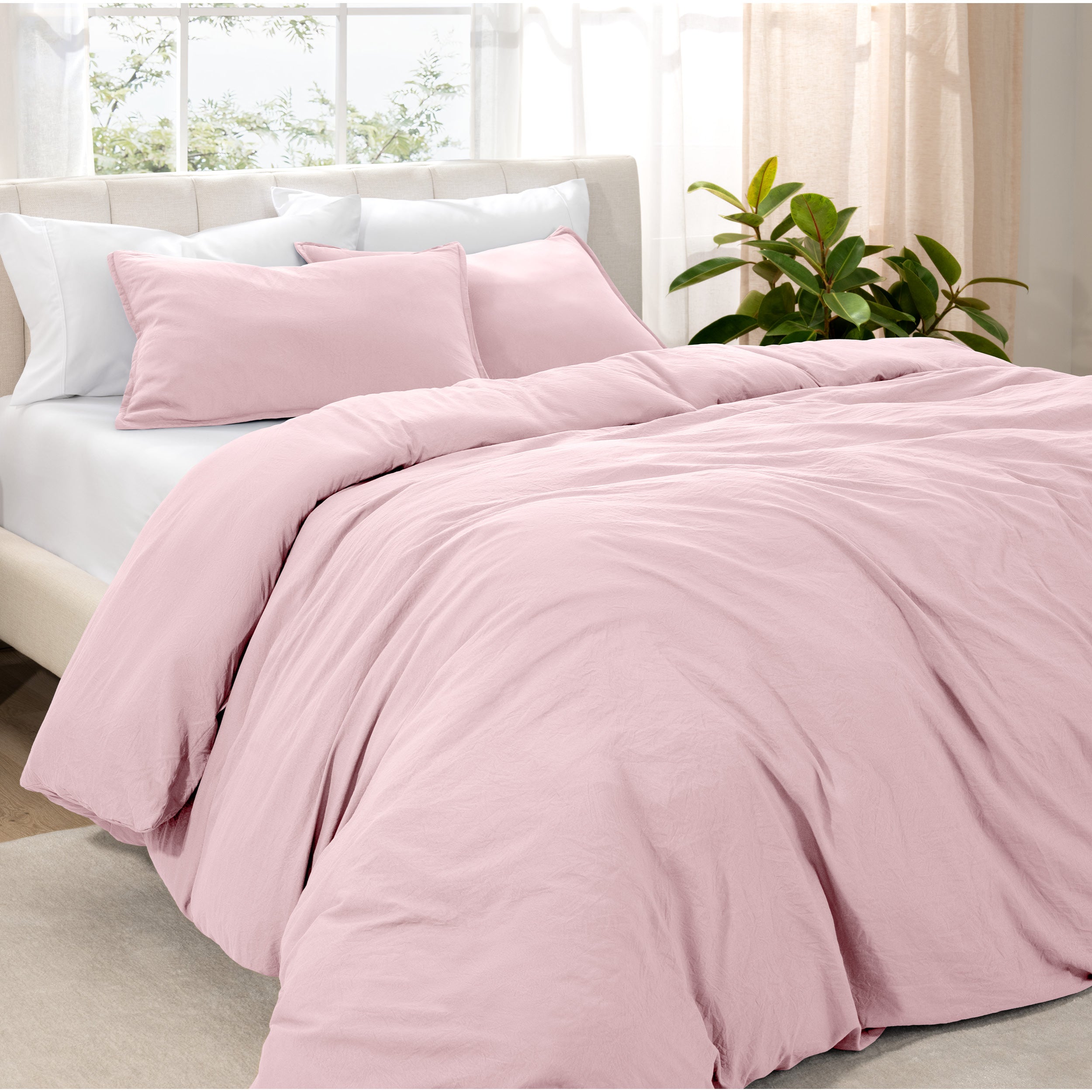 Angled view of bed with a duvet cover folded over on itself