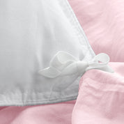 Close up of cloth ties for attaching duvet insert to inside of duvet cover