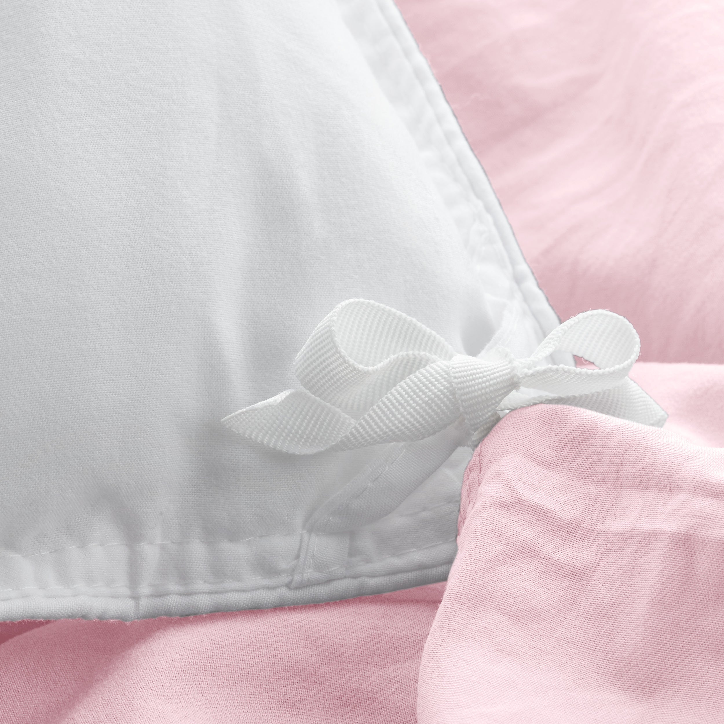 Close up of cloth ties for attaching duvet insert to inside of duvet cover