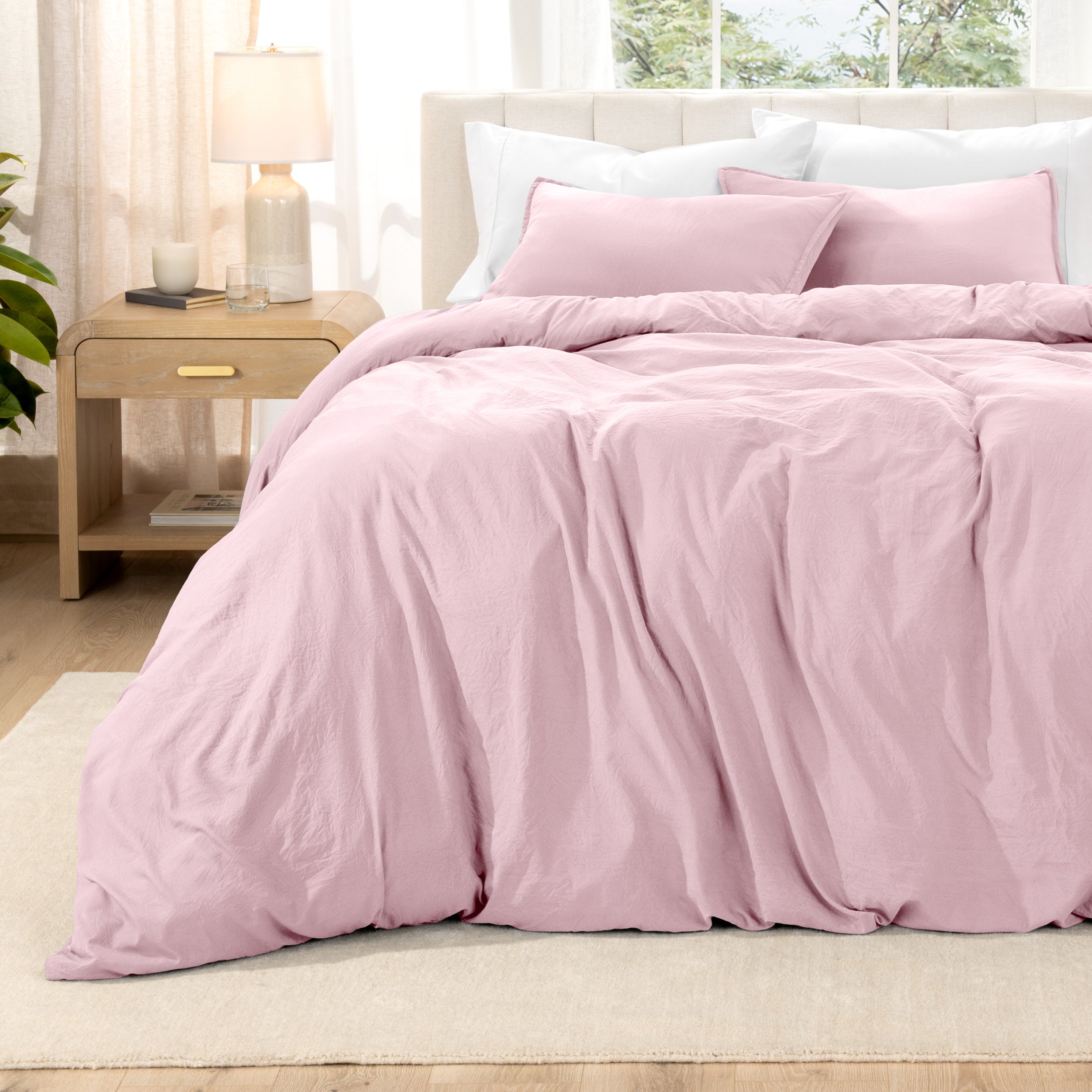 Relaxing room scene with a duvet cover laid out over the bed