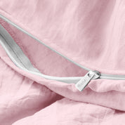 Close up of the zipper on the duvet cover partially opened