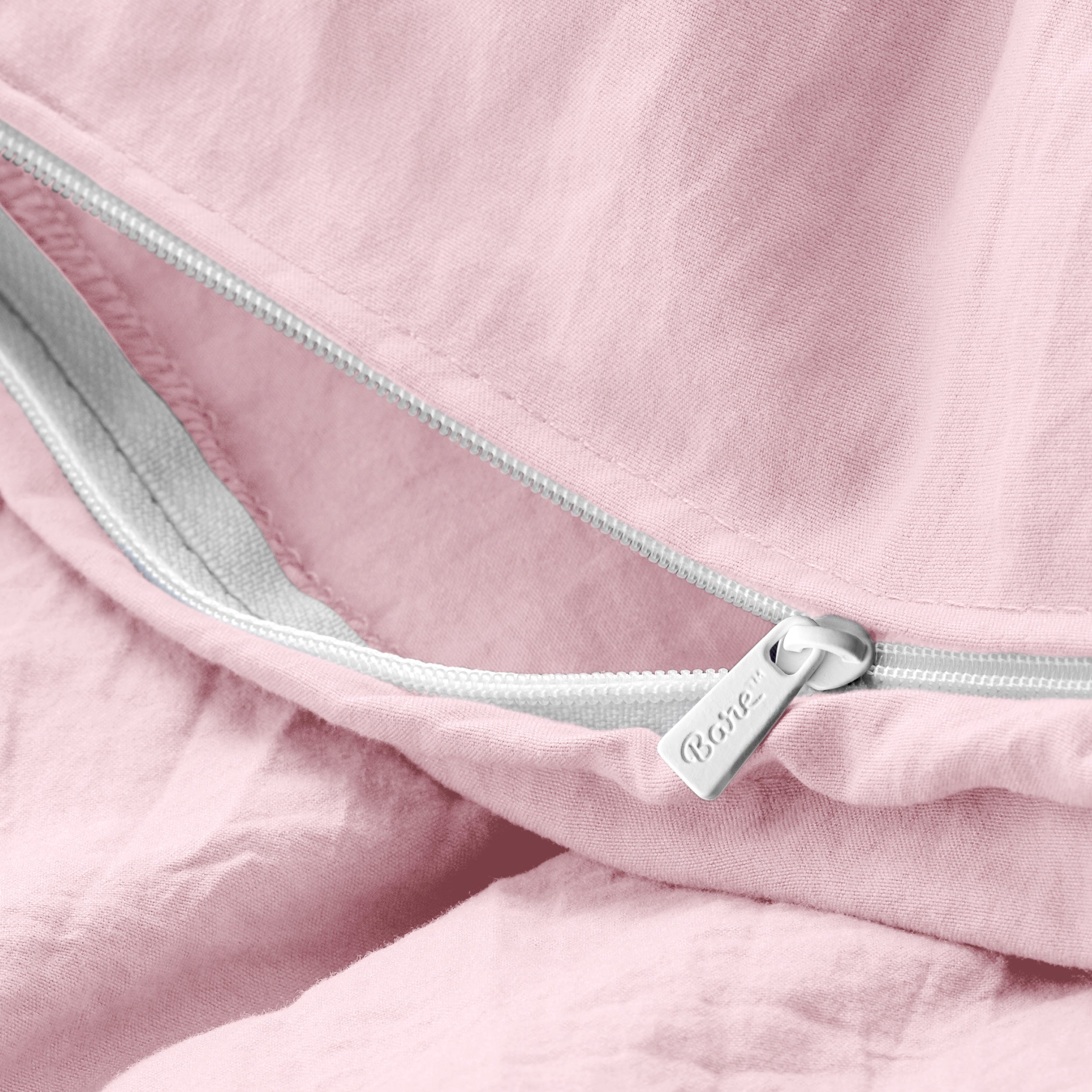 Close up of the zipper on the duvet cover partially opened