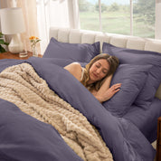 A women sleep on the bed with organic cotton percale duvet cover and pillowcases.