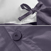A close view of the corner tie of the duvet cover and the buttons for pillow shams