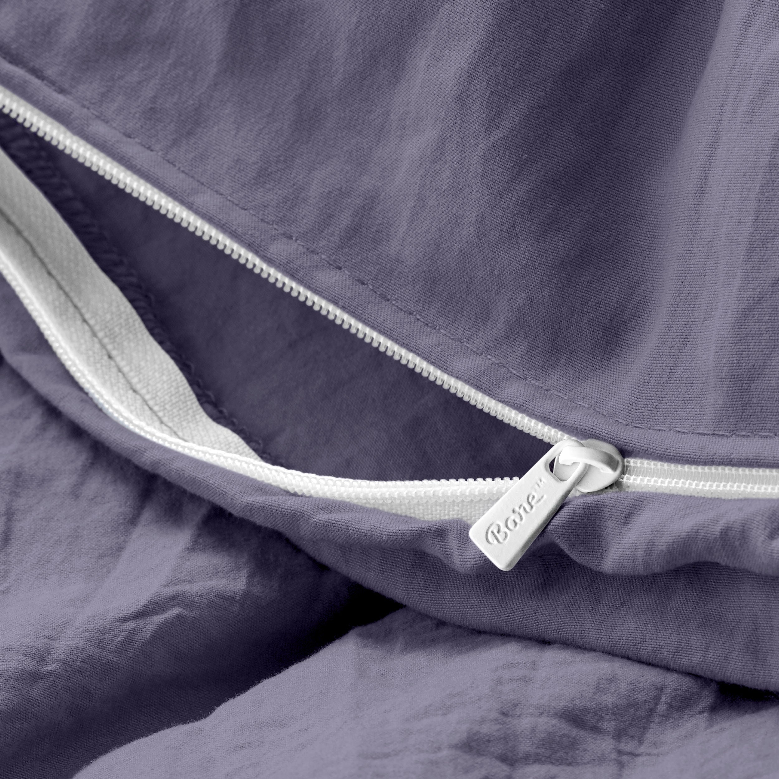 Close up of the zipper on the duvet cover partially opened