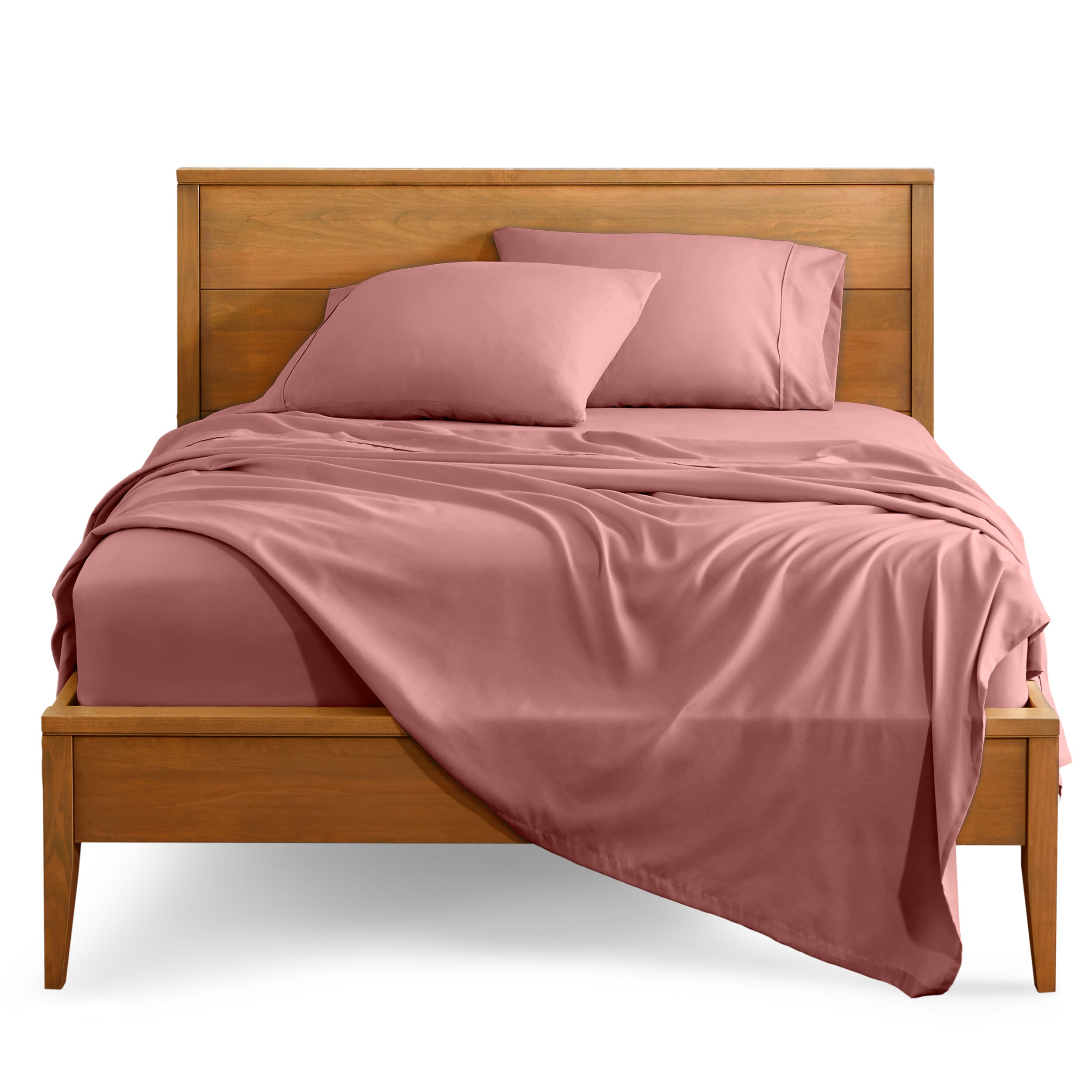 Microfiber sheet set on a bed with a wooden bed frame