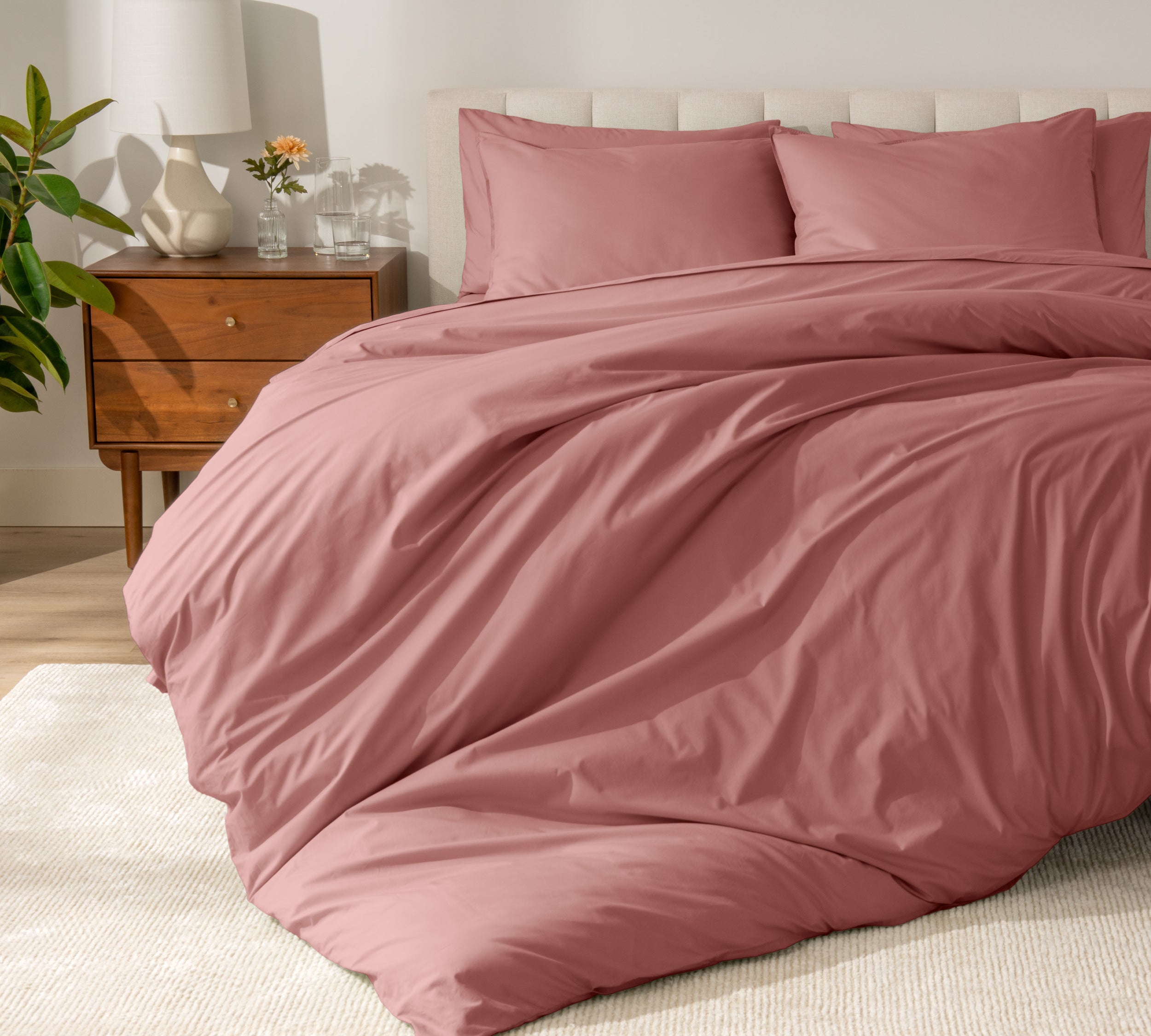A modern bed with a organic cotton percale duvet cover on.