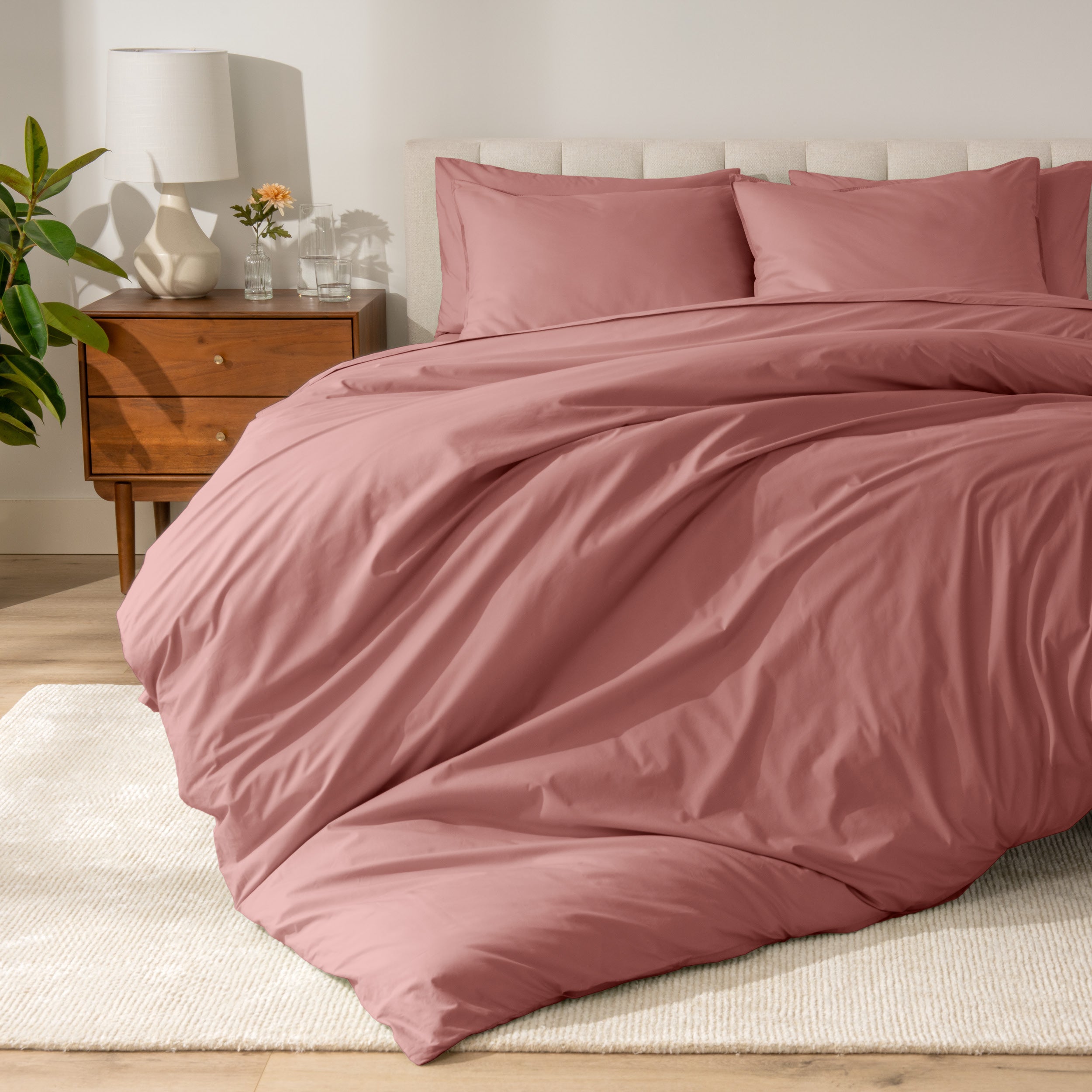 A modern bed with a organic cotton percale duvet cover on.