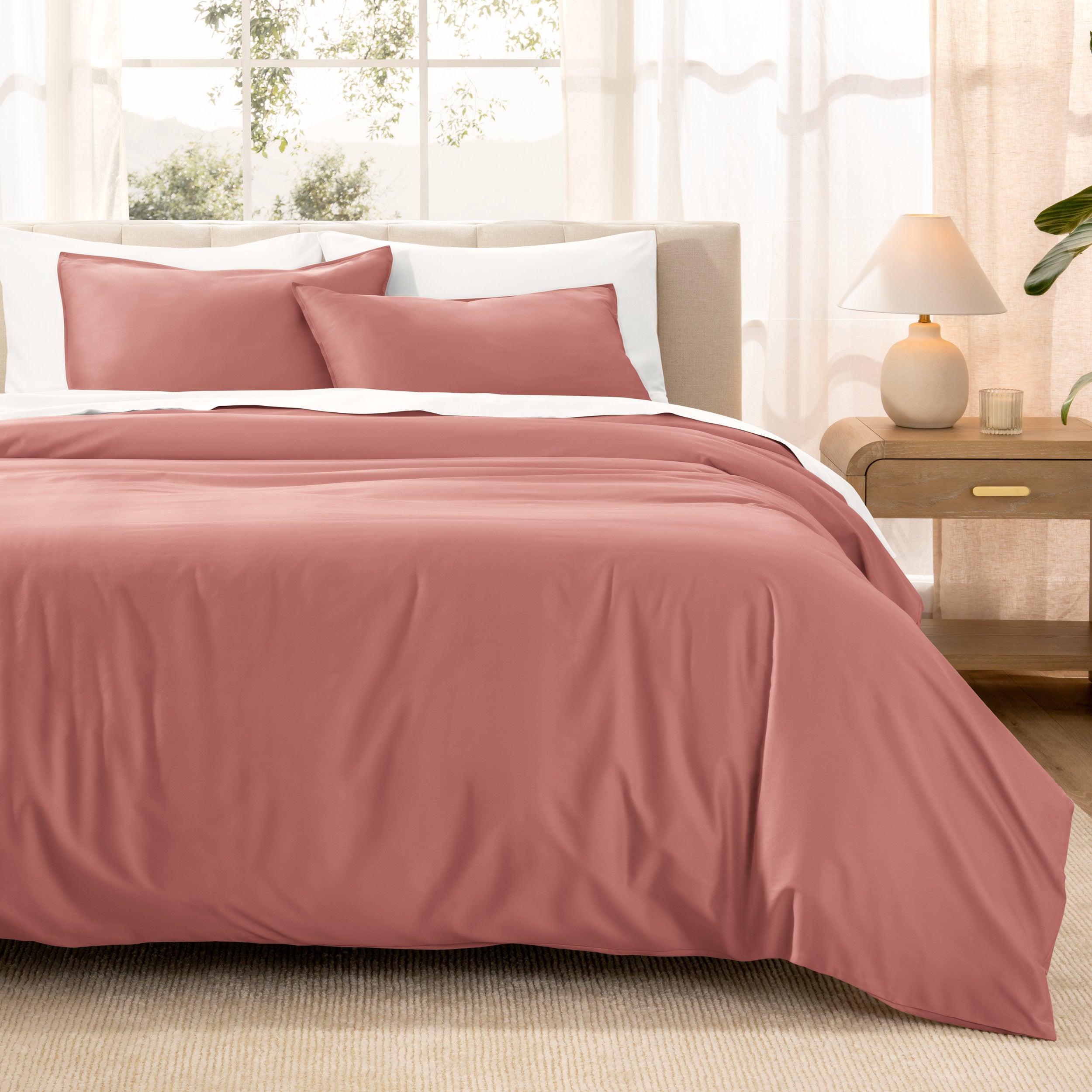 Warm bright room scene showing Sateen Duvet Set  laid out over the bed