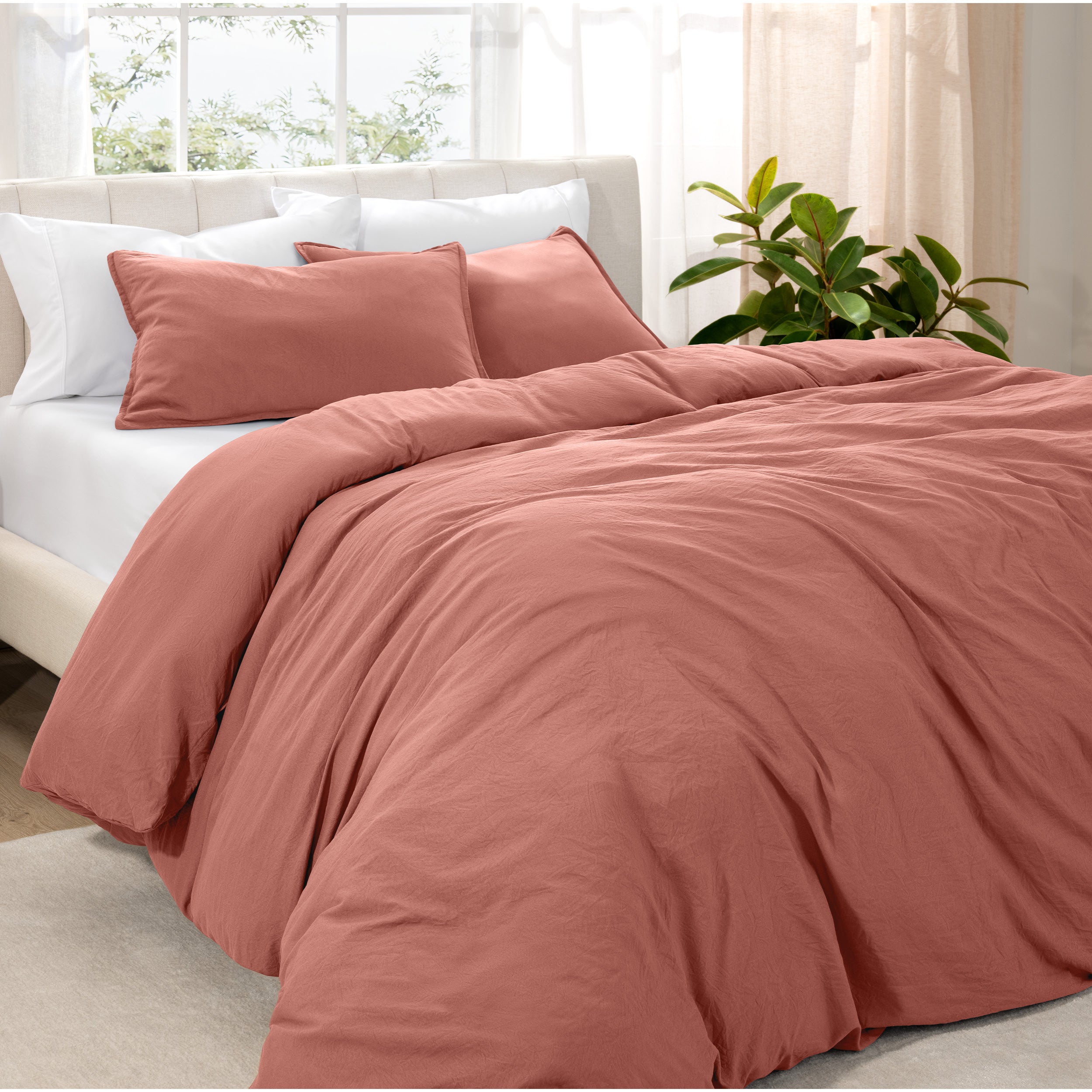 Angled view of bed with a duvet cover folded over on itself