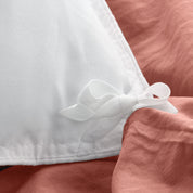 Close up of cloth ties for attaching duvet insert to inside of duvet cover