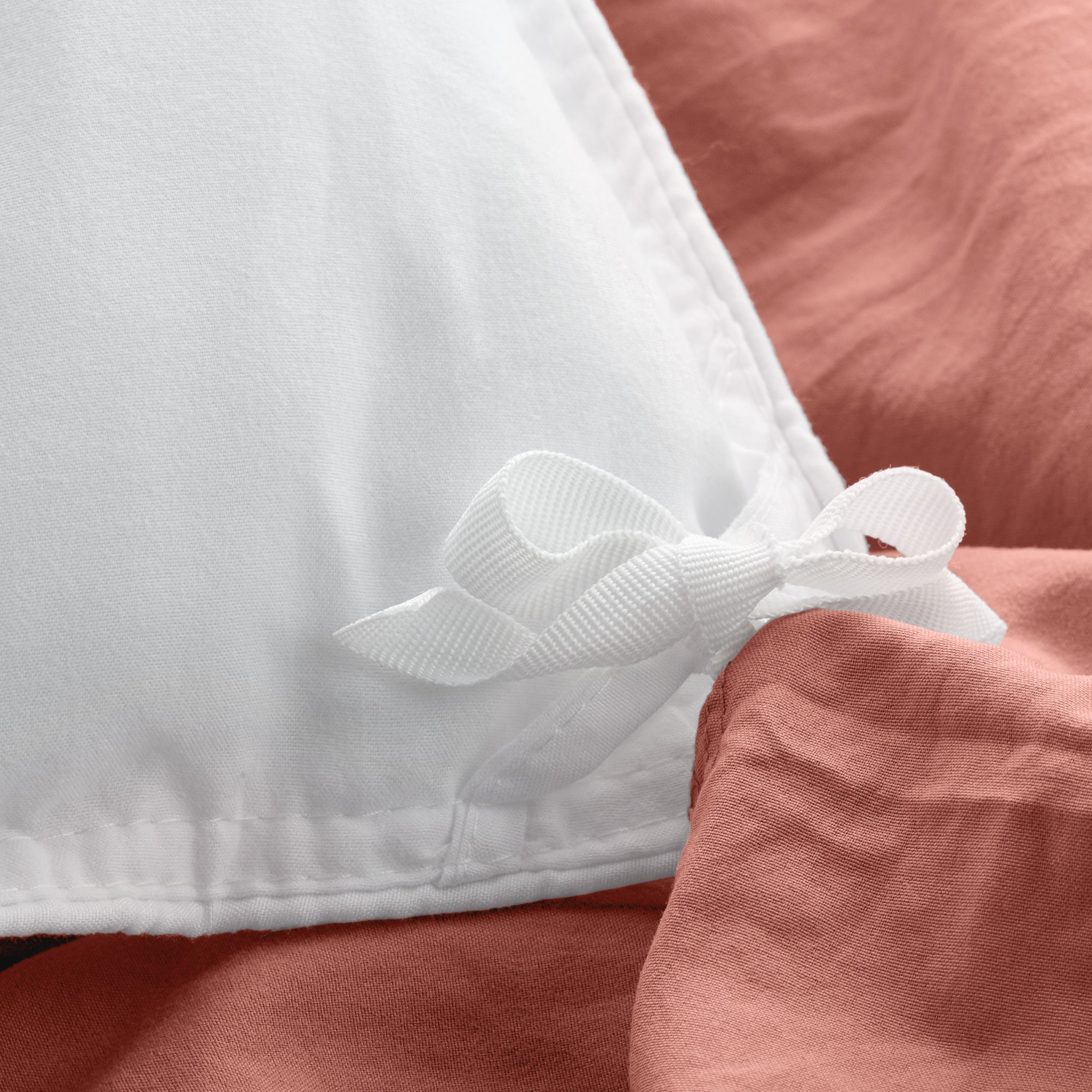 Close up of cloth ties for attaching duvet insert to inside of duvet cover