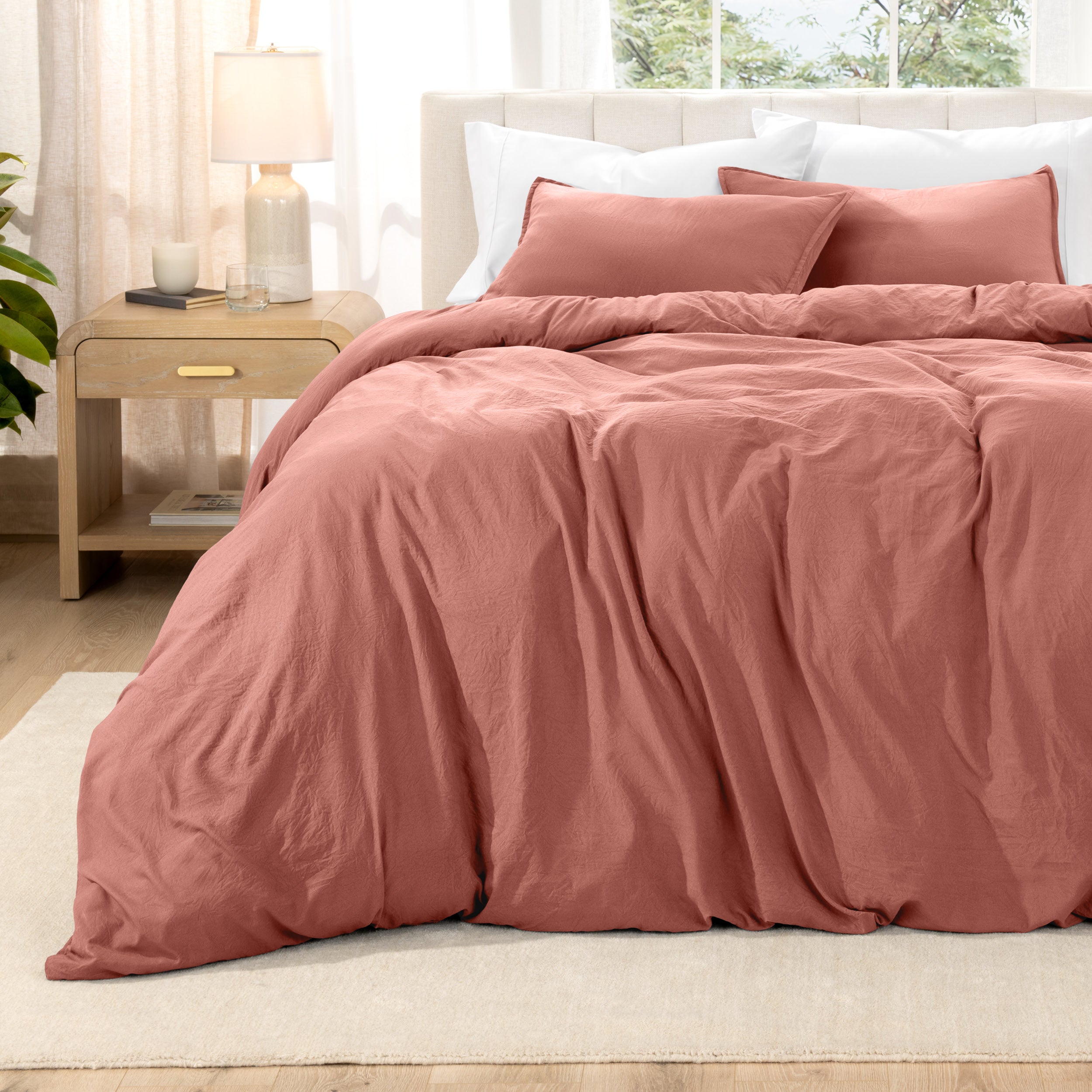 Relaxing room scene with a duvet cover laid out over the bed