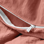 Close up of the zipper on the duvet cover partially opened