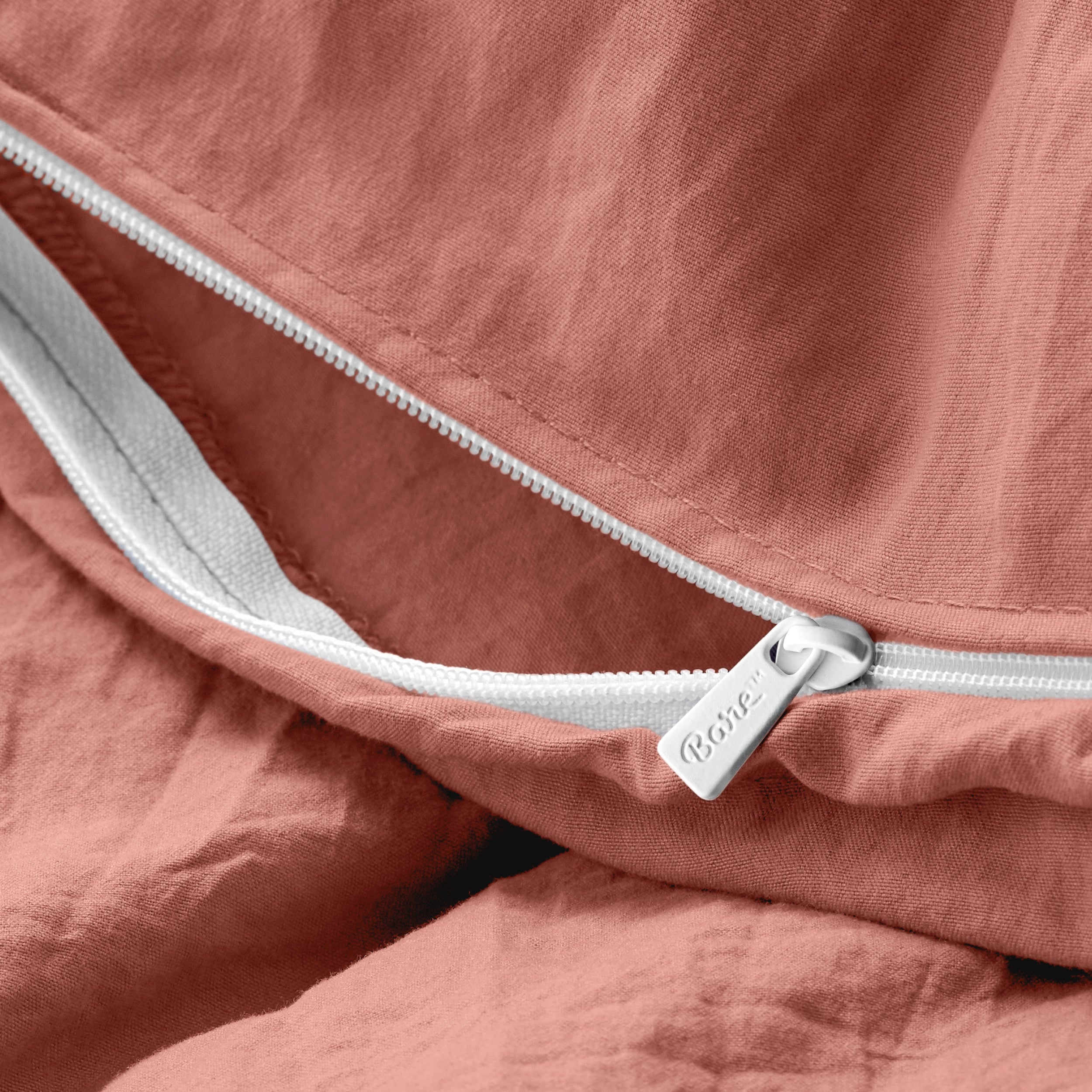 Close up of the zipper on the duvet cover partially opened