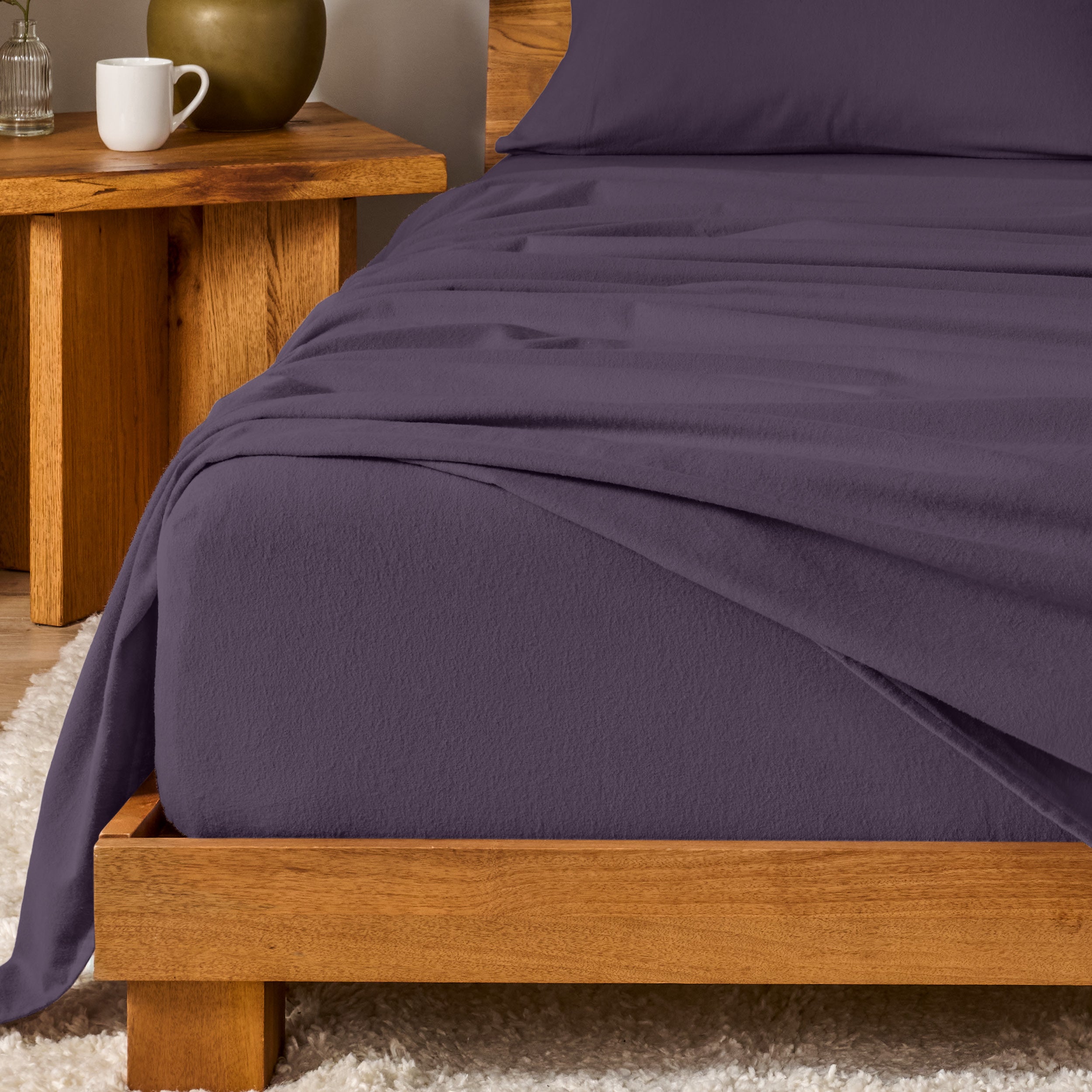 A modern bedroom with cotton flannel sheets on the bed