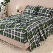A bed made with cotton flannel sheets