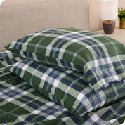 Printed flannel pillowcases and sheets on a bed
