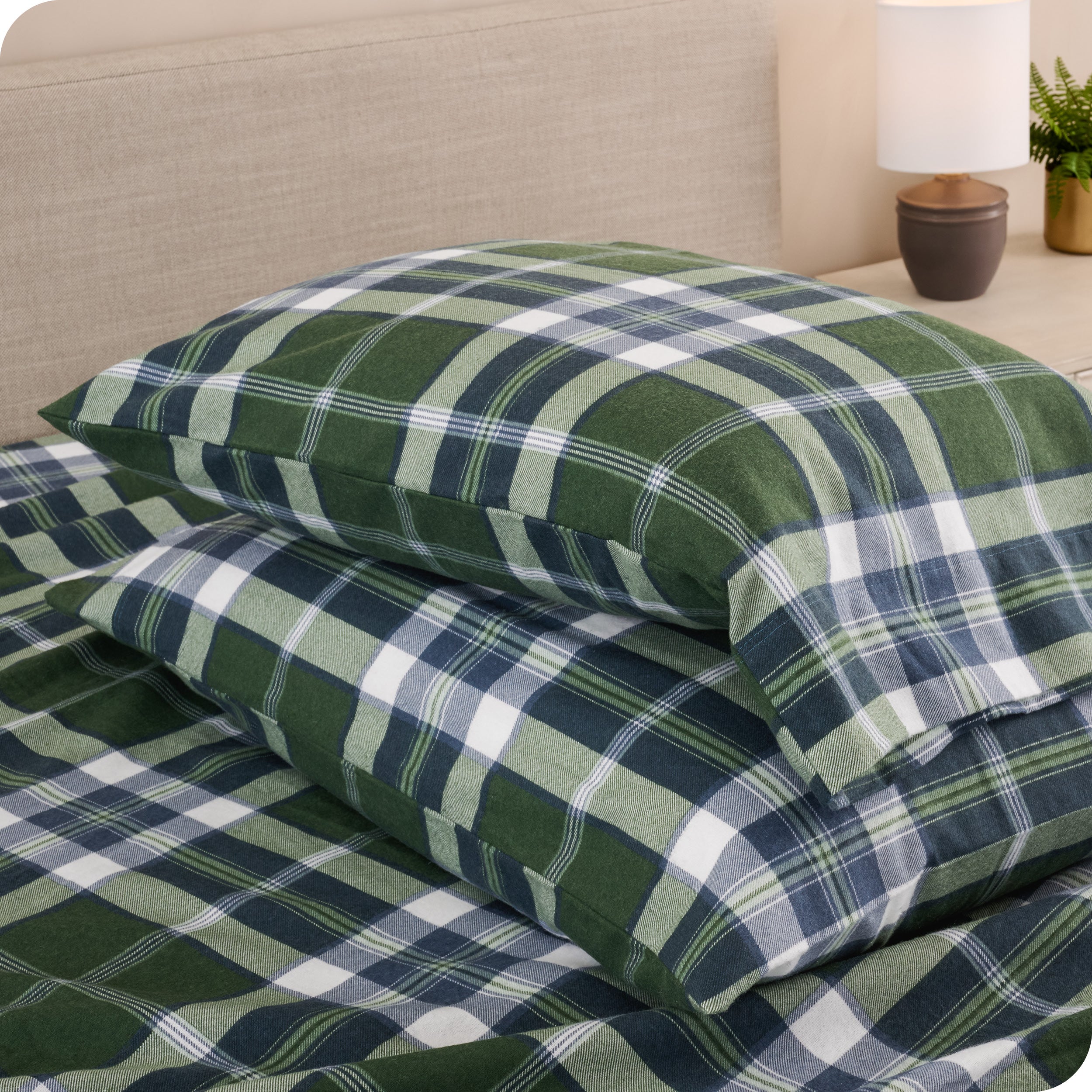 Printed flannel pillowcases and sheets on a bed