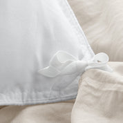 Close up of cloth ties for attaching duvet insert to inside of duvet cover