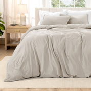 Relaxing room scene with a duvet cover laid out over the bed