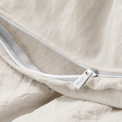 Close up of the zipper on the duvet cover partially opened