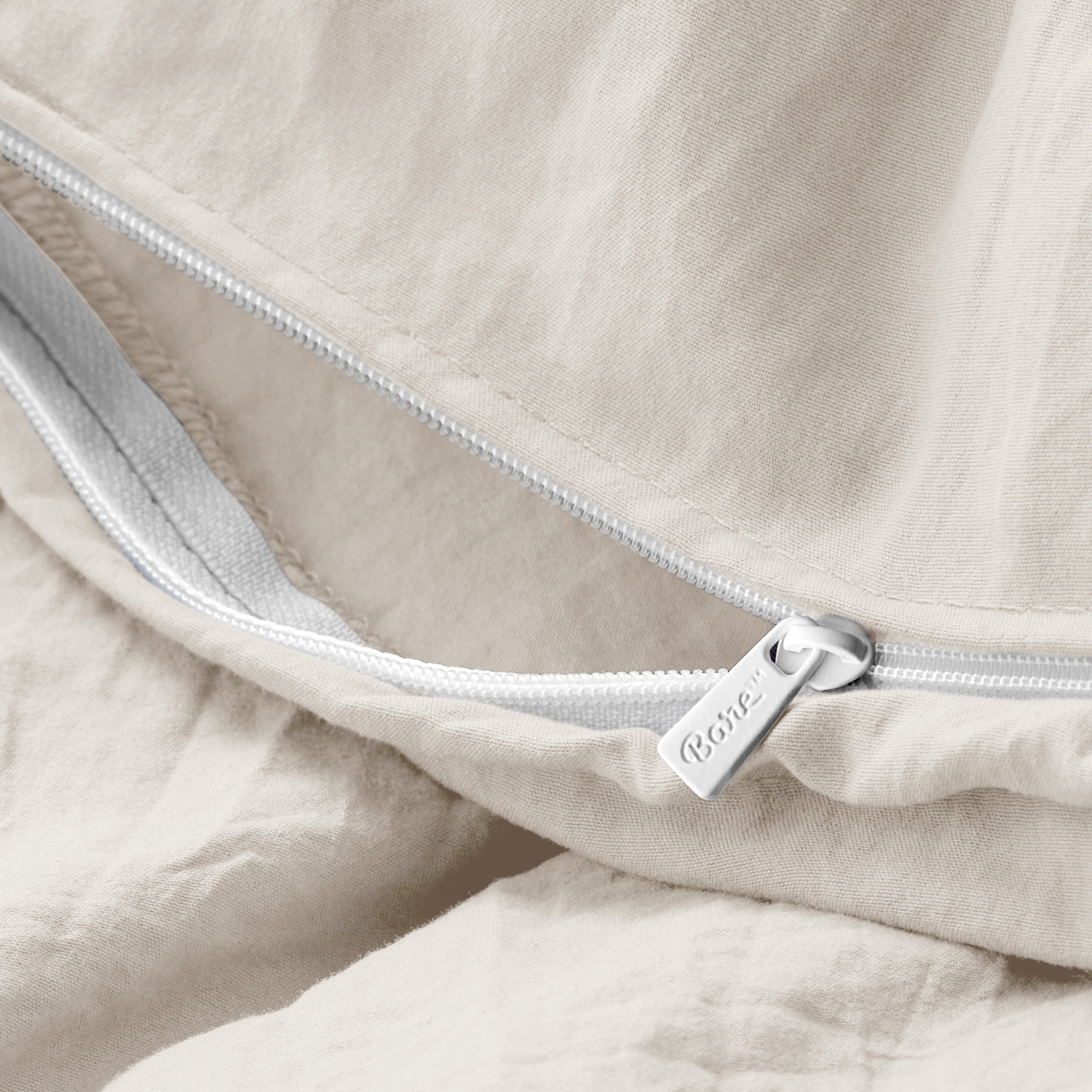Close up of the zipper on the duvet cover partially opened