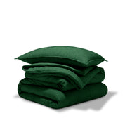 A comforter folded with a matching pillow sham stacked on top