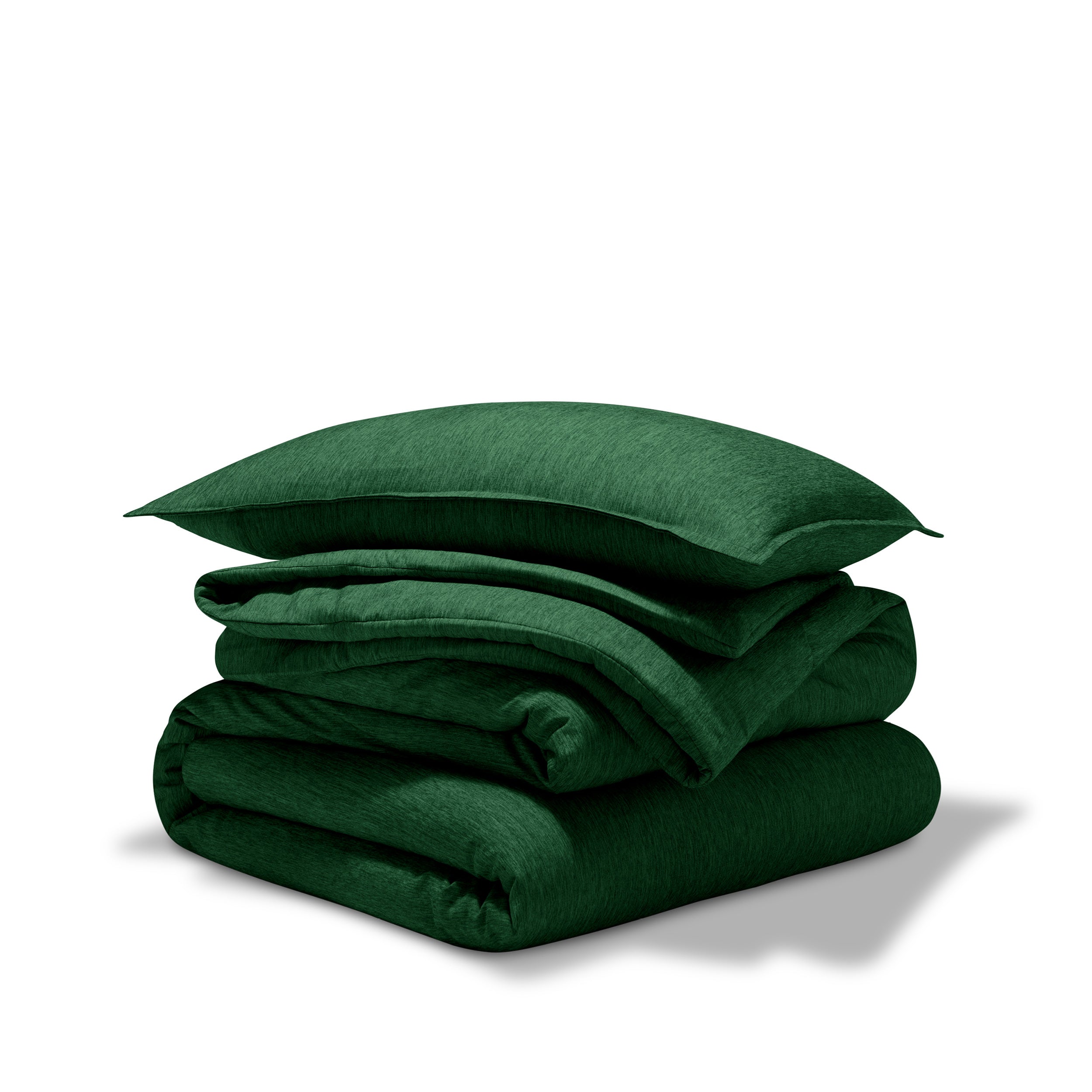 A comforter folded with a matching pillow sham stacked on top