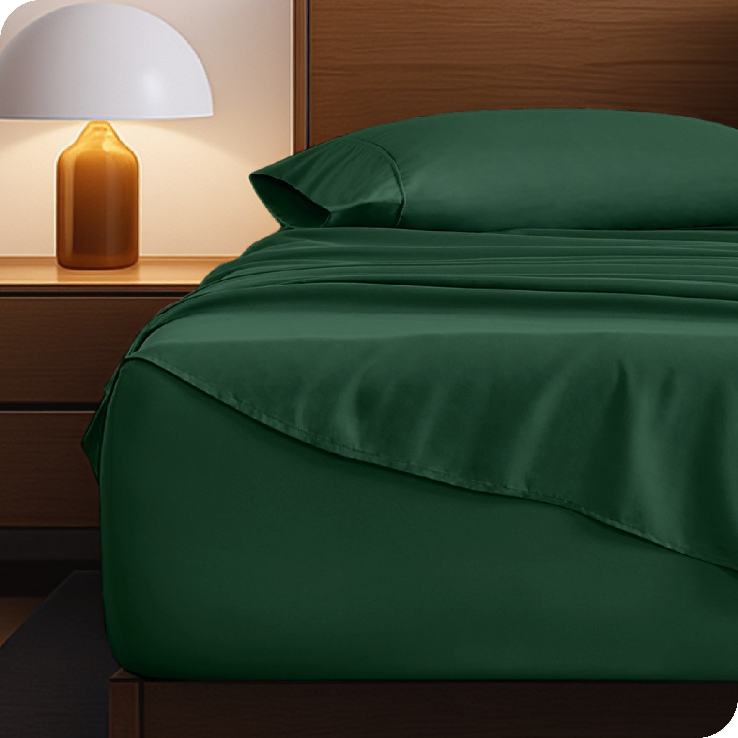 A cozy bedroom with a bed covered in soft microfiber sheets