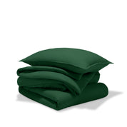 A comforter folded with a matching pillow sham stacked on top