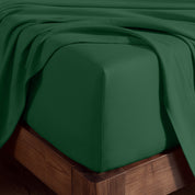A corner of bed with fitted sheet to show the deep pocket feature and the texture.