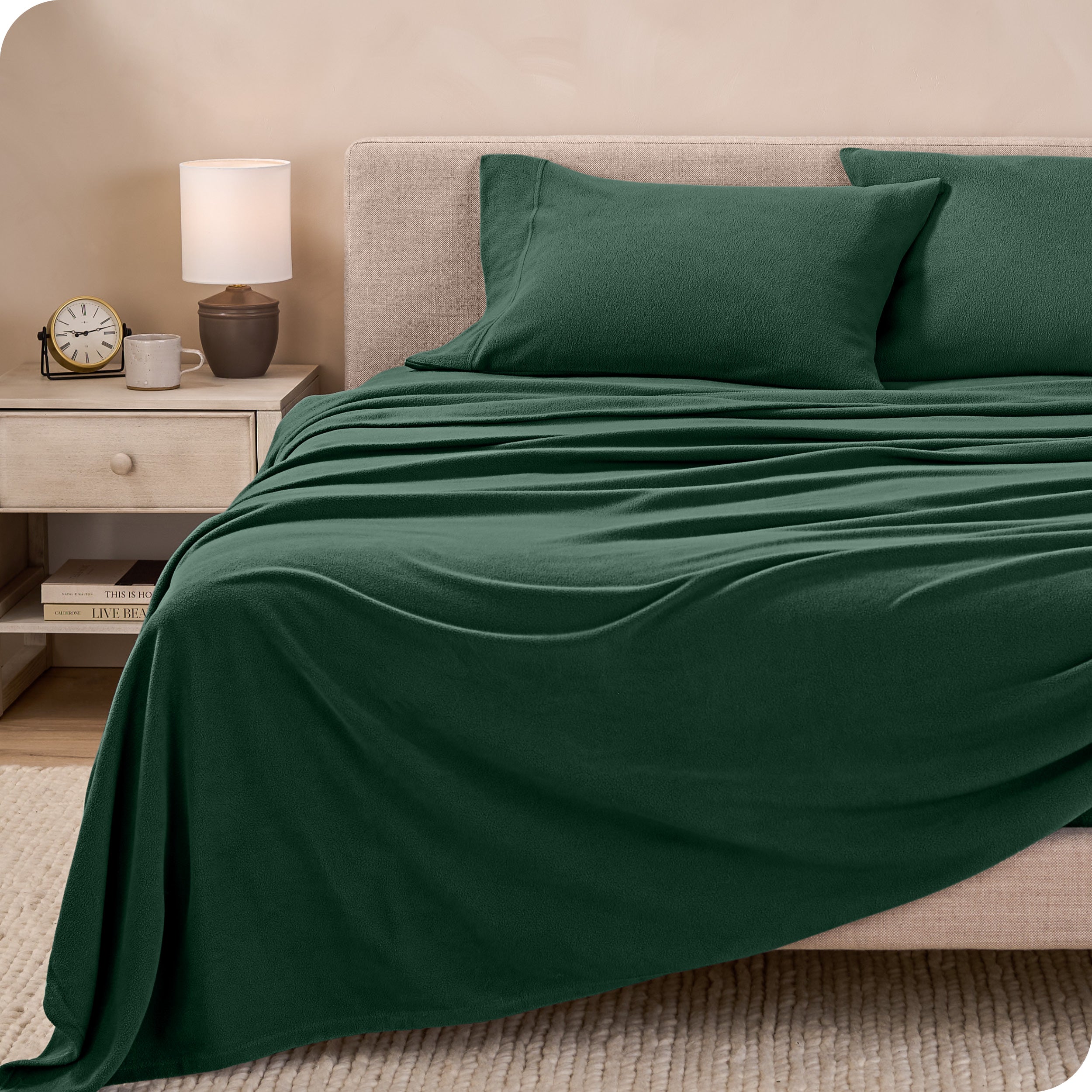 View of fleece sheets from the end of a bed with the top sheet draped over the side and end