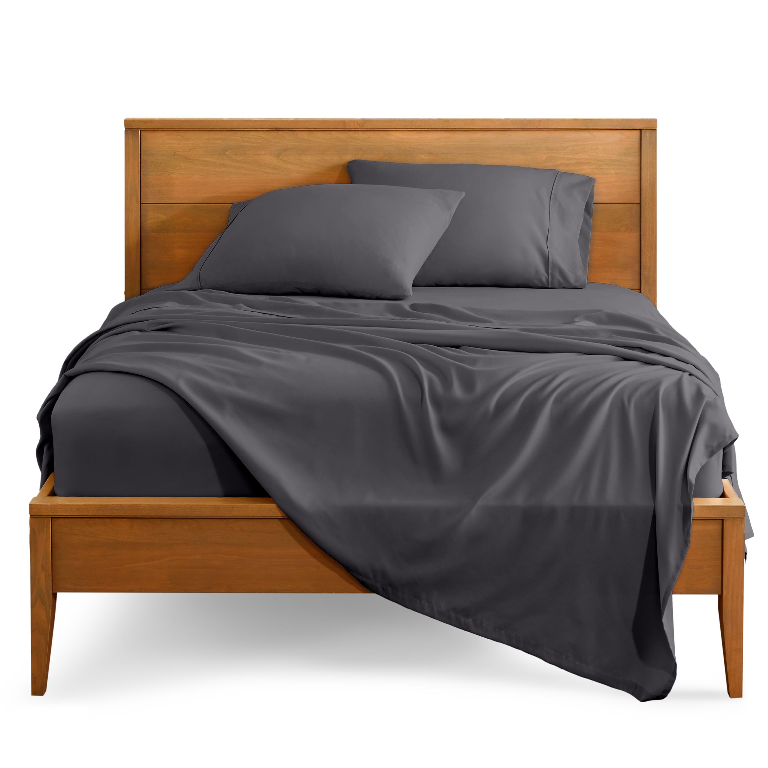 Microfiber sheet set on a bed with a wooden bed frame