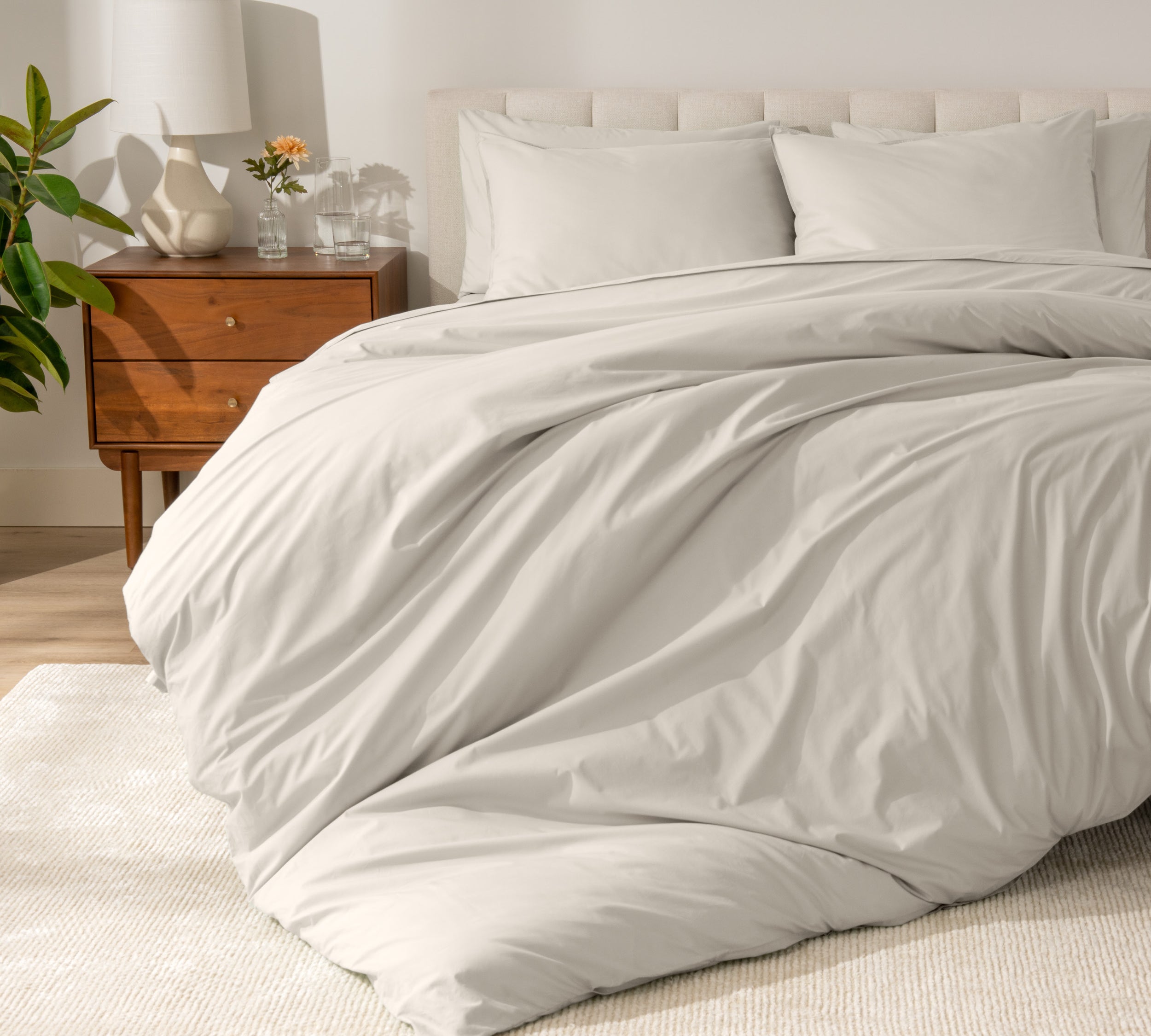 A modern bed with a organic cotton percale duvet cover on.