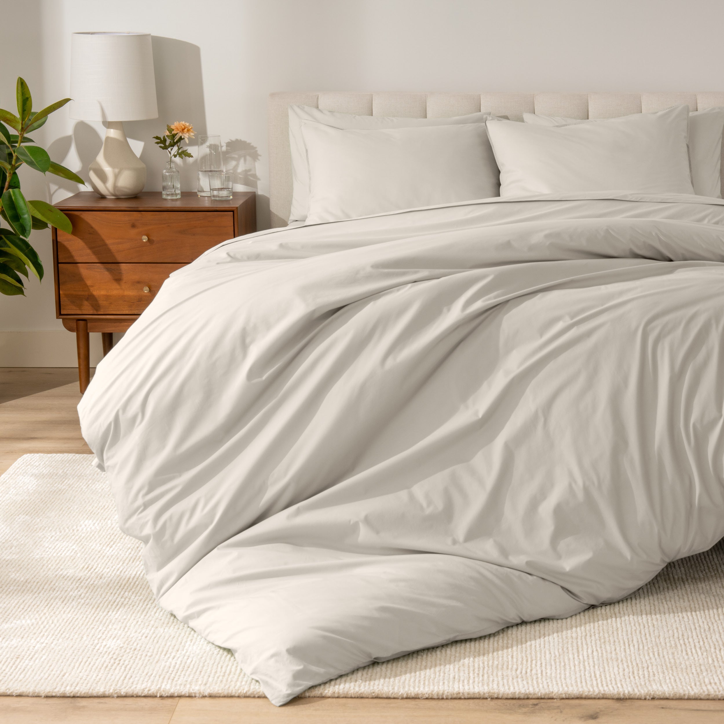A modern bed with a organic cotton percale duvet cover on.