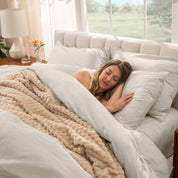 A women sleep on the bed with organic cotton percale duvet cover and pillowcases.