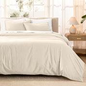 Warm bright room scene showing Sateen Duvet Set  laid out over the bed